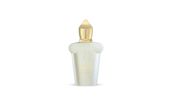 A white perfume bottle with a gold cap. The bottle has elegant curves and features the word "Casamorati" at the top and "Quattro Pizzi" underneath, hinting at its enchanting summer scent.