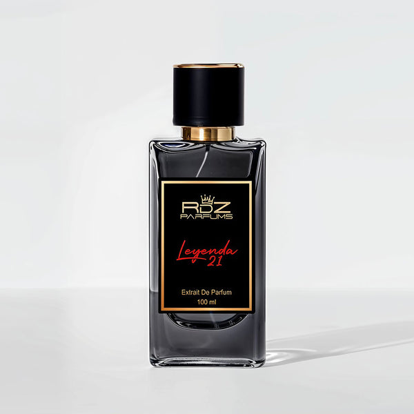 A clear glass bottle with a black and gold label that reads "Leyenda 21 RDZ Parfums, Extrait de Parfum, 100 ml." Inspired by the luxurious scent, the bottle features a black cap with gold trim, echoing the elegance of Roberto Clemente’s legacy.