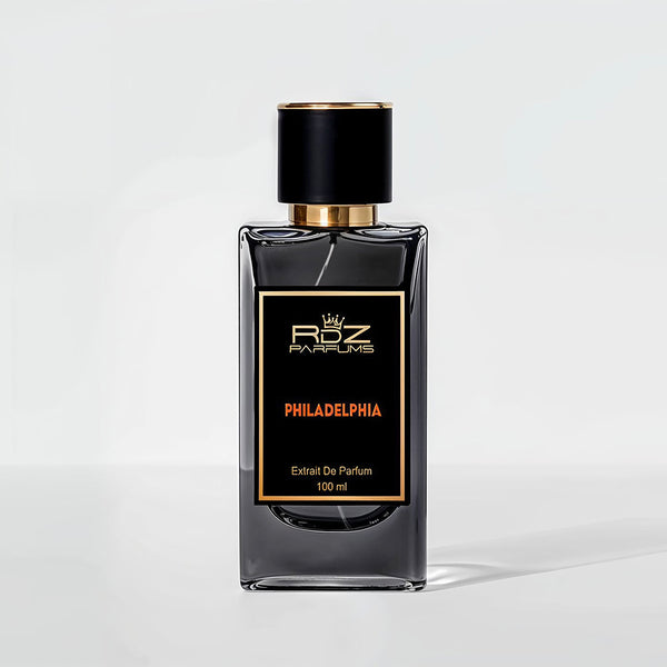A black rectangular perfume bottle labeled "PHILADELPHIA Extrait De Parfum 100 ml," with a gold and black cap, displayed against a plain white background. The PHILADELPHIA fragrance by RDZ Parfums captures the city's vibrant spirit in every drop.