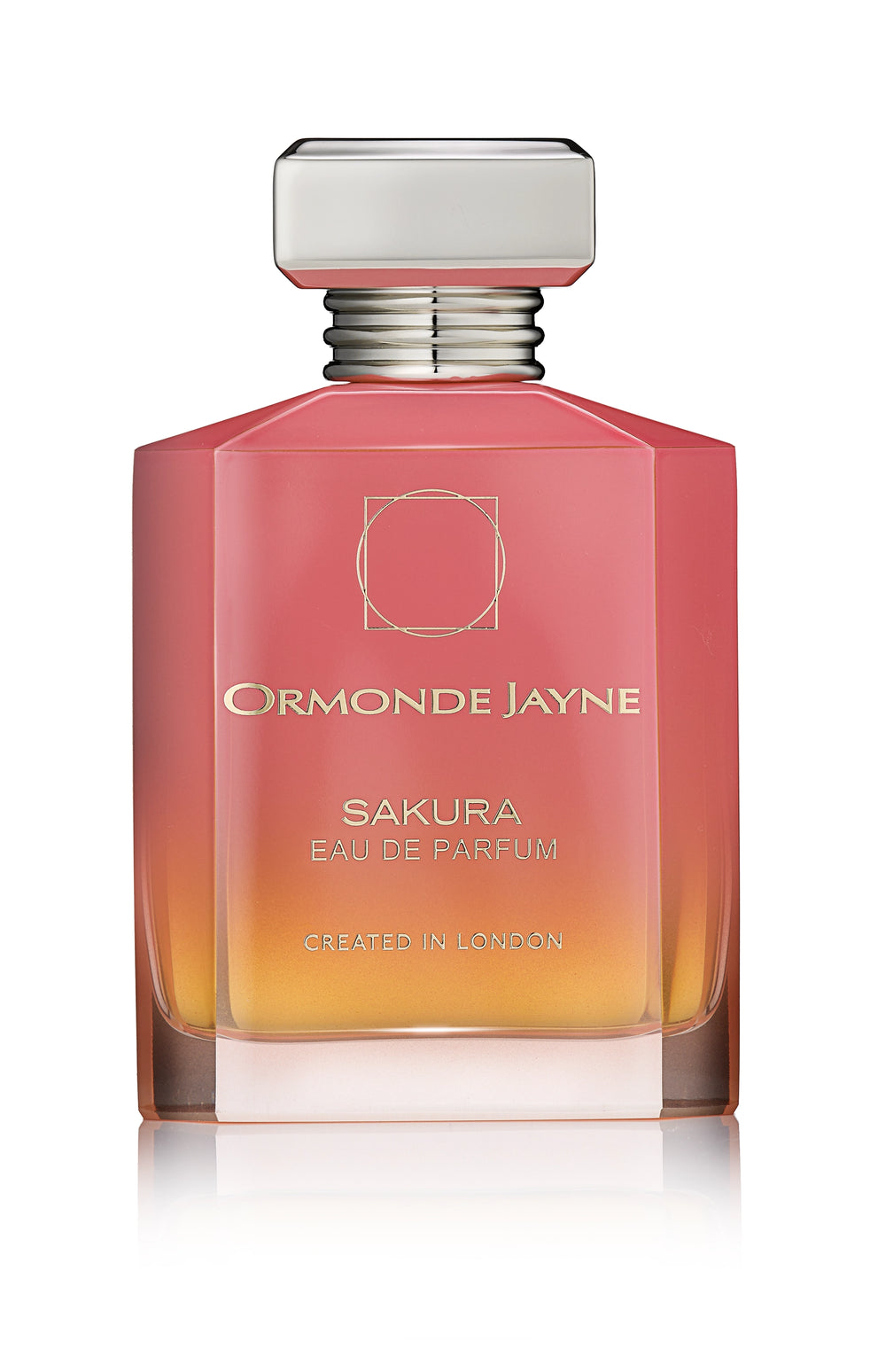 A bottle of Sakura Eau de Parfum by Ormonde Jayne, adorned with a pink-to-orange gradient design and a silver cap, proudly displays the label "Created in London" at the bottom and beautifully encapsulates notes of cherry blossom and Madagascan vanilla.