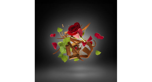 A red rose with petals, cinnamon sticks, green leaves, and scattered spices suspended in a dark, gradient background create an atmosphere reminiscent of Xerjoff Iommi DEIFIED.