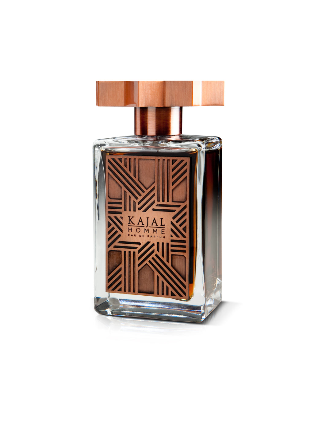 A clear glass bottle of Kajal Homme from the Kajal - Classic Collection features a copper-colored rectangular cap and geometric pattern on the label, exemplifying this refined men's fragrance by Kajal Perfumes Paris.