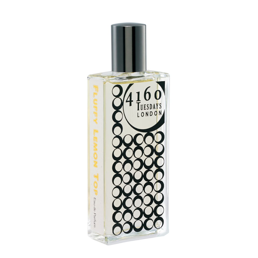 A rectangular glass perfume bottle with a black cap, labeled "4160Tuesdays Fluffy Lemon Top," featuring a design of black circles on a white background, reminiscent of an art deco ice cream parlour.