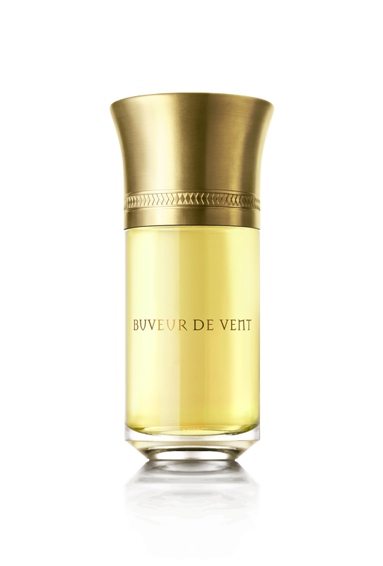 A bottle of Liquides Imaginaires' Buveur De Vent perfume with a gold cap, light yellow liquid, and a hint of cypress oil.
