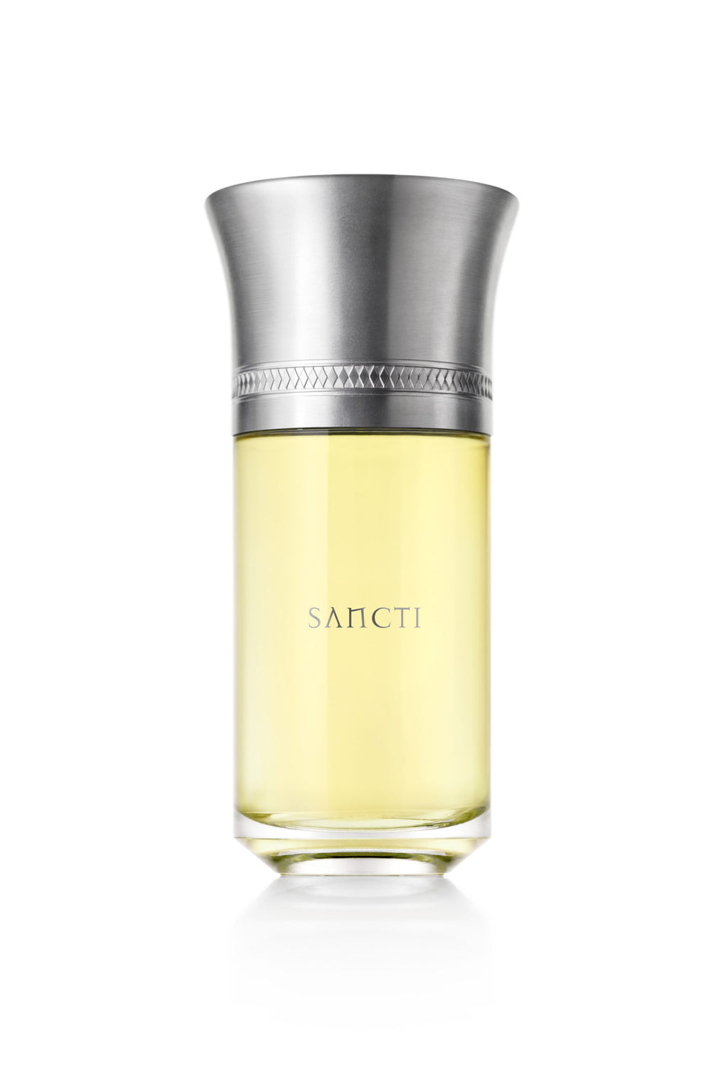 The Sancti perfume by Liquides Imaginaires comes in a cylindrical, transparent bottle featuring a wide silver cap. Inside, it holds a yellow liquid that evokes spiritual elevation and is reminiscent of woodsy incense.
