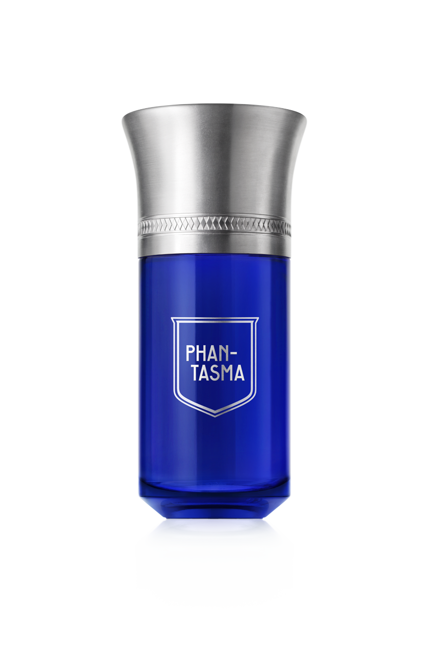 A blue bottle of Phan-Tasma perfume by Liquides Imaginaires, featuring a silver cap and engraved detailing, infused with the essence of sensual wood.