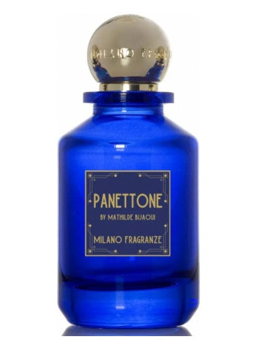 A blue glass bottle labeled "PANETTONE by Milano Fragranze," capped with a gold spherical top, exudes an inviting aura of bitter orange and vanilla.