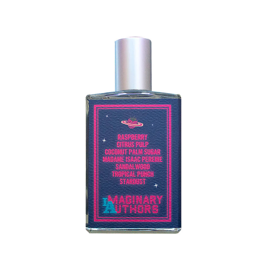 A bottle of In Love with Everything by Imaginary Authors features a sumptuous blend of scent notes including raspberry, citrus pulp, coconut palm sugar, sandalwood, tropical punch, and stardust—an opulent fragrance that exudes luxury and indulgence.