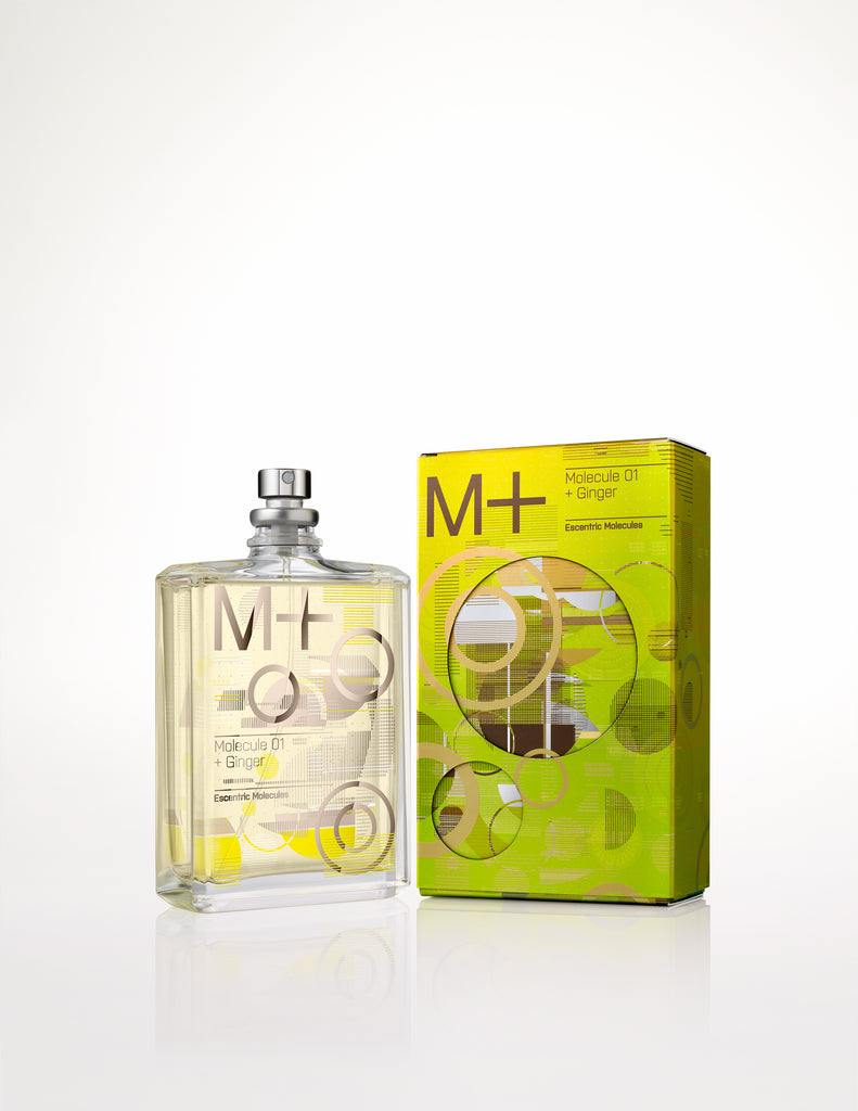 Image of a rectangular glass perfume bottle labeled "Escentric Molecules Molecule 01 + Ginger" next to its green and yellow cardboard packaging on a white background, highlighting the unique blend of Iso E Super and ginger oil.