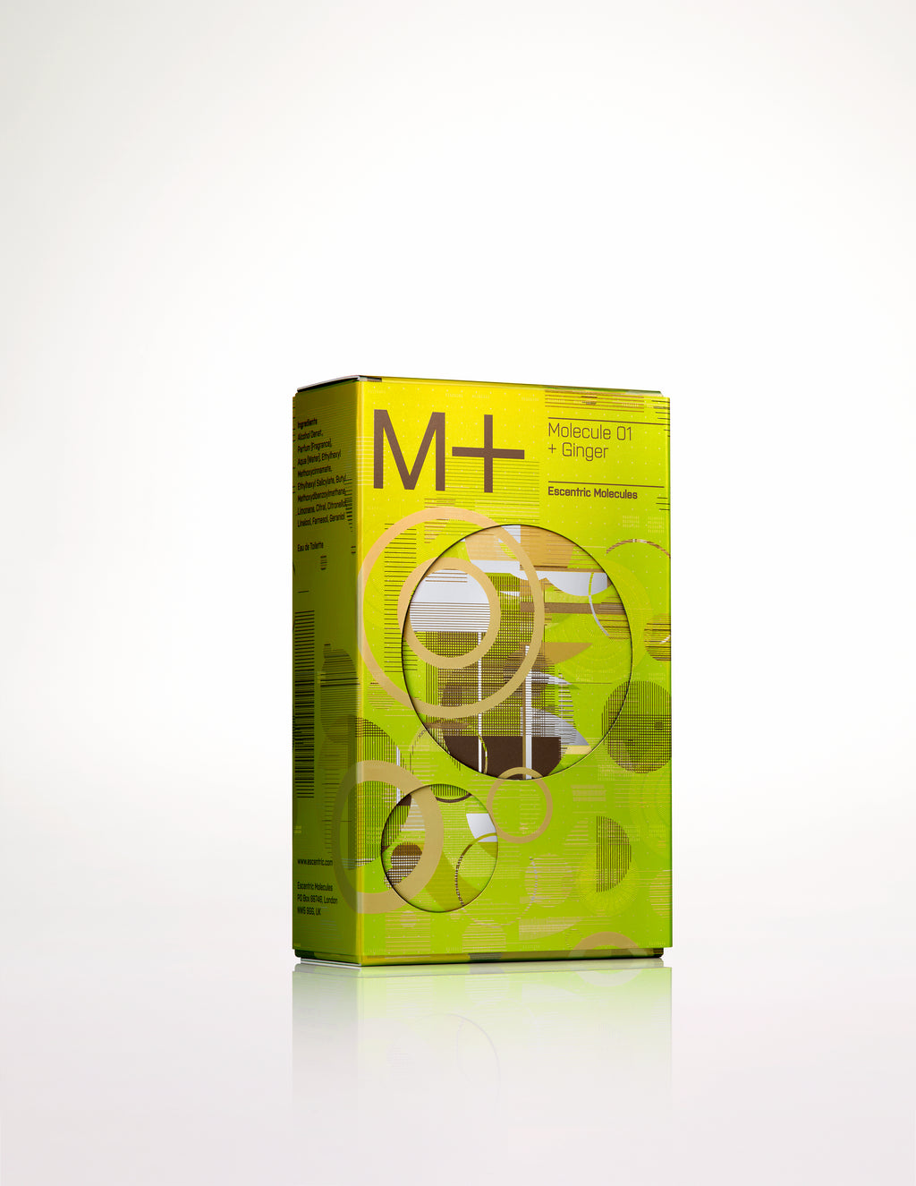 A rectangular green and yellow product box labeled "M+" from Escentric Molecules, containing Molecule 01 + Ginger. The box design showcases circular patterns and text on the front and side, emphasizing the inclusion of Iso E Super.