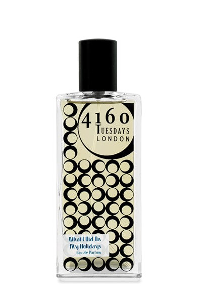 A rectangular perfume bottle with a black cap. The label showcases "4160Tuesdays London" along with a pattern of black circles and the phrase "What I Did on My Holidays Eau de Parfum" at the bottom, featuring notes of mint and candy floss from one of our best-selling scents.