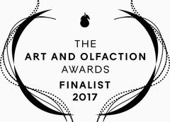 Logo showing "The Art and Olfaction Awards Finalist 2017" with decorative lines, an abstract scent bottle at the top, and a hint of animalistic musks for Civet by Zoologist.