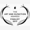 Logo showing "The Art and Olfaction Awards Finalist 2017" with decorative lines, an abstract scent bottle at the top, and a hint of animalistic musks for Civet by Zoologist.