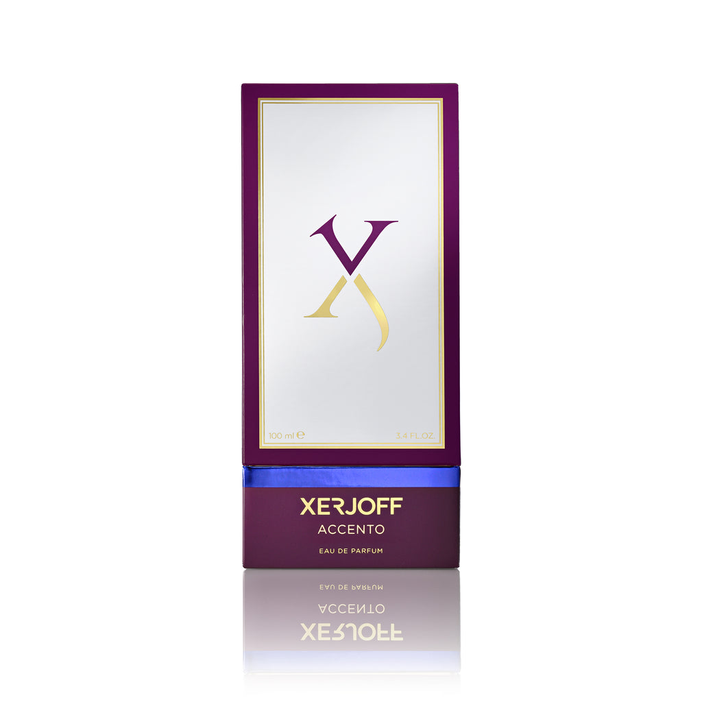 A bottle of Accento Xerjoff, featuring a sleek rectangular design with purple and gold accents, embodies pure luxury with its alluring fruity scent.