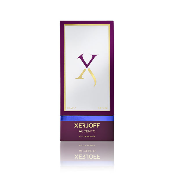 A bottle of Accento Xerjoff, featuring a sleek rectangular design with purple and gold accents, embodies pure luxury with its alluring fruity scent.