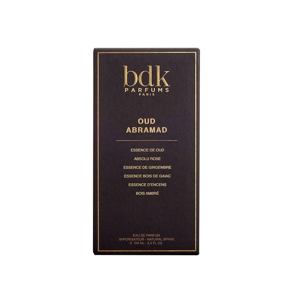 A black rectangular perfume box featuring gold text that reads "BDK Parfums Paris, Oud Abramad" along with ingredients and fragrance notes including oud, Turkish rose, ginger, agarwood, gaiac wood, incense, and amber.