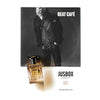 A perfume bottle labeled "Jusbox Beat Café" is placed in front of a monochrome photo of a person on an album cover titled "Beat Café," evoking the spirit of the Beat Generation and the soulful essence that Bob Dylan captured in 1962.