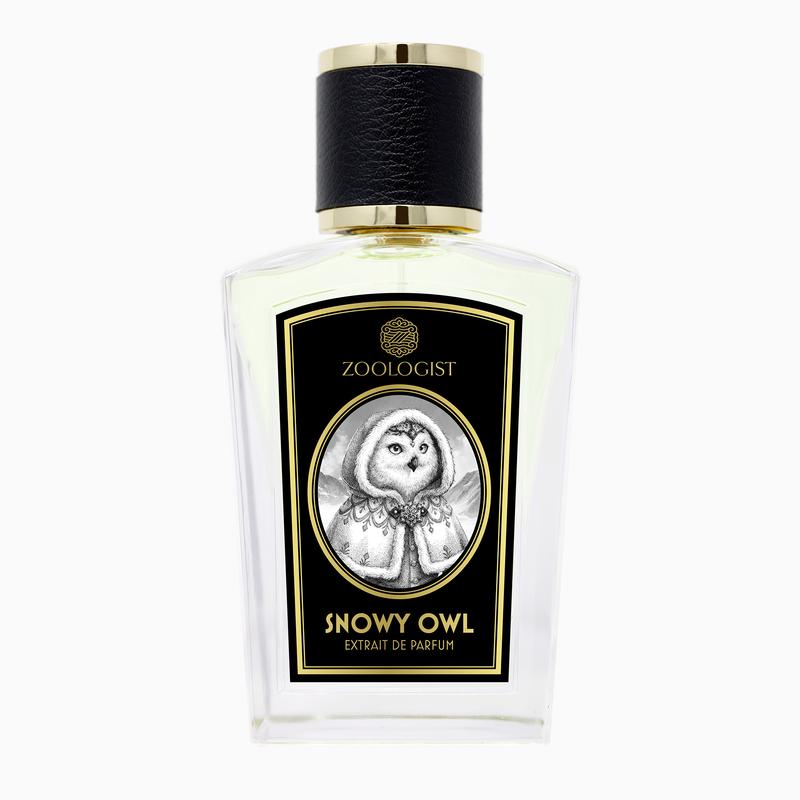 A bottle of Zoologist Snowy Owl with a black cap and a label featuring an illustration of a snowy owl emanates a captivating coconut vanilla scent.