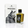 A Rhinoceros-themed perfume bottle labeled "Rhinoceros" stands next to its matching box, both featuring artwork of an anthropomorphic rhinoceros in a suit by Prin Lomros. The brand name "Zoologist" is prominently displayed on each, promising a sophisticated scent with hints of Red Earth Tobacco.