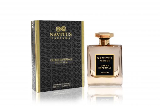 A bottle of Creme Imperial by Navitus Parfums sits next to a box, exuding a captivating fragrance crafted by a Master Perfumer.