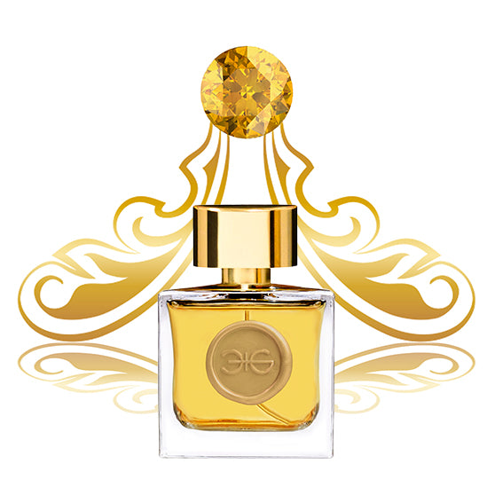 A square glass perfume bottle with a gold cap and gold emblem, set against an ornate golden design backdrop featuring a central gem-like ornament, radiates golden energy. This CITRINE Extrait de Parfum by Manos Gerakinis embodies empowerment in every detail.