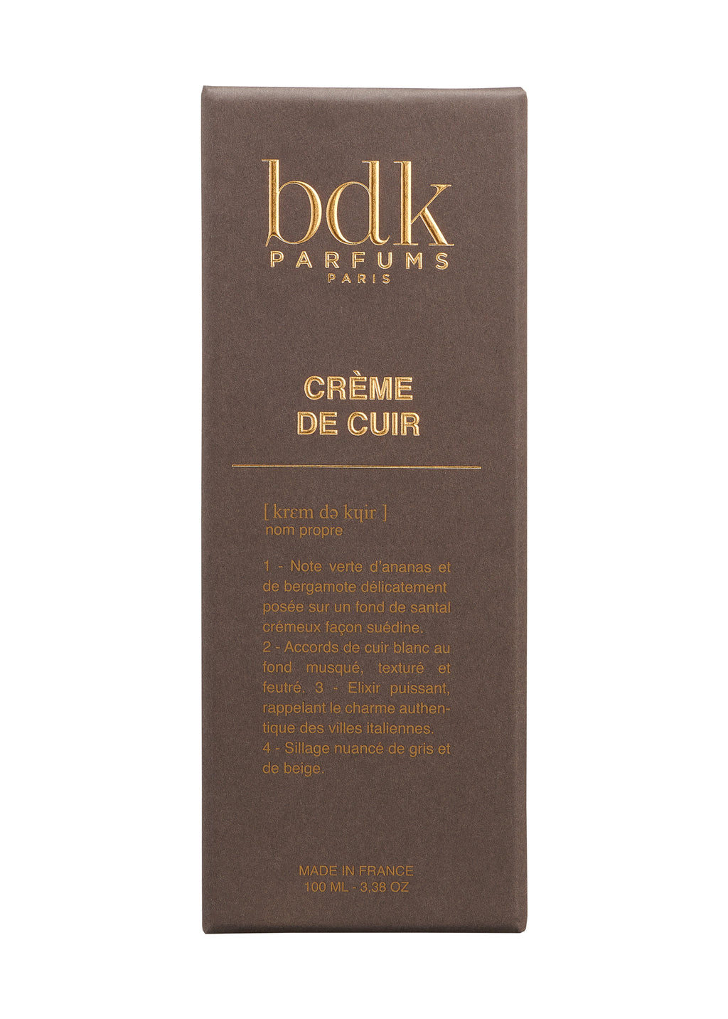 A brown box with gold and white text that reads: “BDK Parfums, Crème de Cuir.” The packaging includes fragrance notes evoking contemporary sensuality and is labeled "Made in France, 100 ml, 3.38 oz.