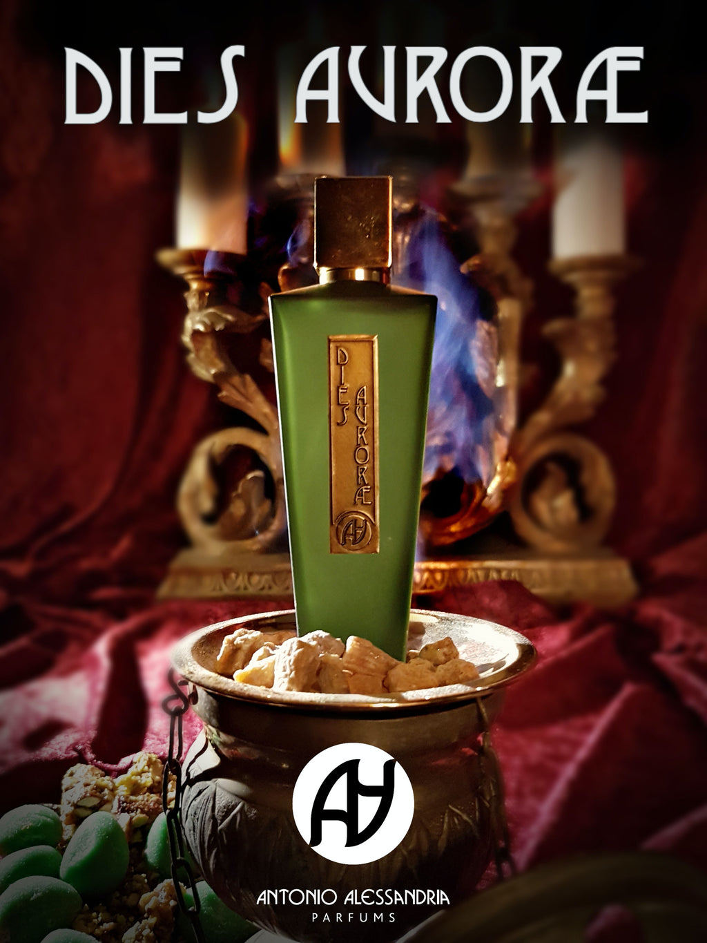 A green bottle of Antonio Alessandria's "Dies Aurorae" stands on a stone pedestal filled with beige stones against a backdrop of red fabric and a flame, reminiscent of the vibrant Saint Agata feast. The company logo is at the bottom of the image.