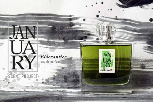 A green perfume bottle labeled "Eiderantler by January Scent Project" sits against a black and white artistic background.