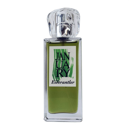 A clear glass bottle of perfume labeled "Eiderantler" by January Scent Project, with green liquid inside, evoking the delicate notes of Ivy Fougère.