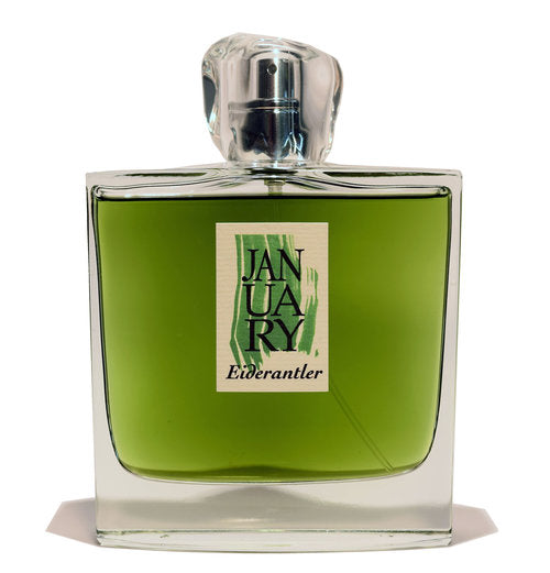 A rectangular glass bottle of green liquid labeled "Eiderantler" from the January Scent Project, featuring a transparent cap, is displayed.