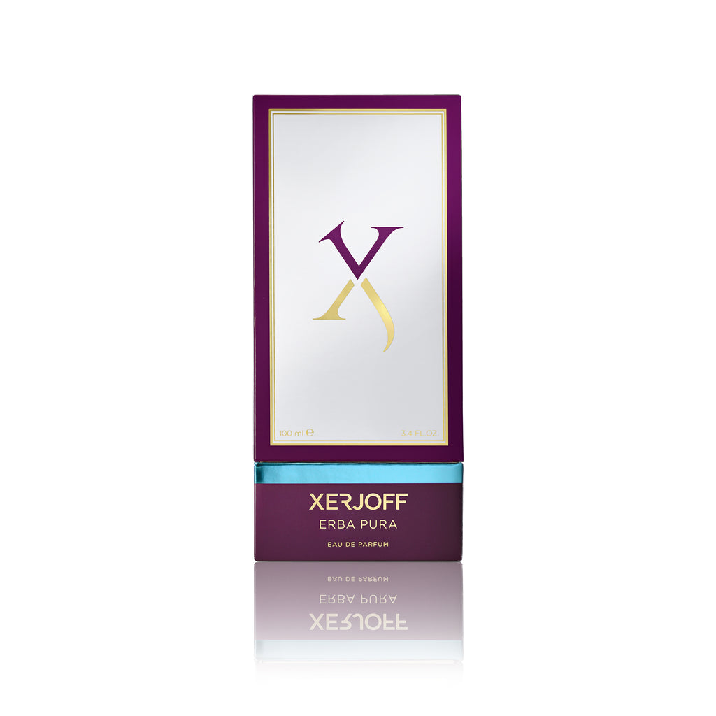 A rectangular box of Erba Pura by Xerjoff with a white and purple design. The brand name and perfume name are displayed at the bottom of the box, evoking a sense of a Mediterranean fruit basket blended with hints of luxurious white musk.
