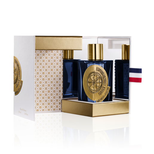 Perfume set in gold-and-blue display box with navy bottle and gold cap
