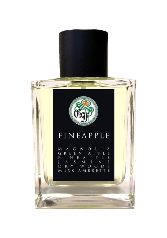 A square glass bottle of Gallagher Fragrances’ Fineapple perfume, topped with a black cap. The label details the vibrant scents of magnolia, green apple, and pineapple, enhanced by jasmine, dry woods, and musk ambrette. An artistic logo embellishes the top of the label.