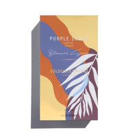 A colorful rectangular product box titled "Purple Suede" by Goldfield & Banks, featuring abstract designs in purple, orange, and yellow hues with a white leaf illustration evokes the sense of Lavender Tasmania.