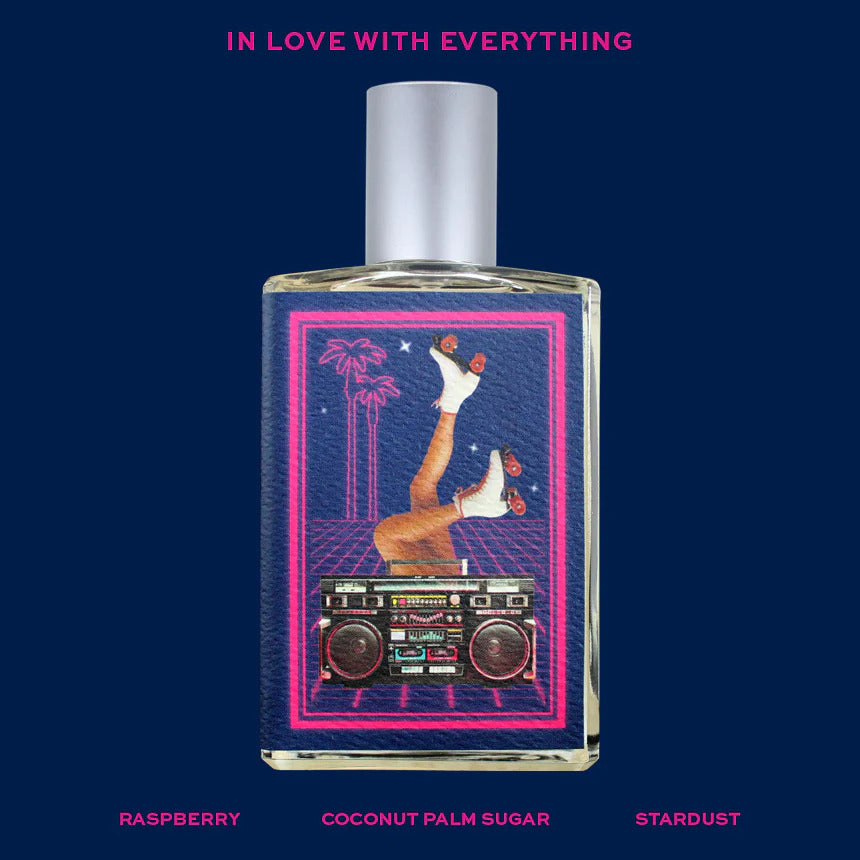 The "In Love with Everything" perfume by Imaginary Authors features a lively label showcasing legs clad in roller skates alongside a boombox. Above the image, the text "In Love With Everything" emits an air of sheer indulgence. The fragrance is crafted with notes of raspberry, coconut palm sugar, and stardust.