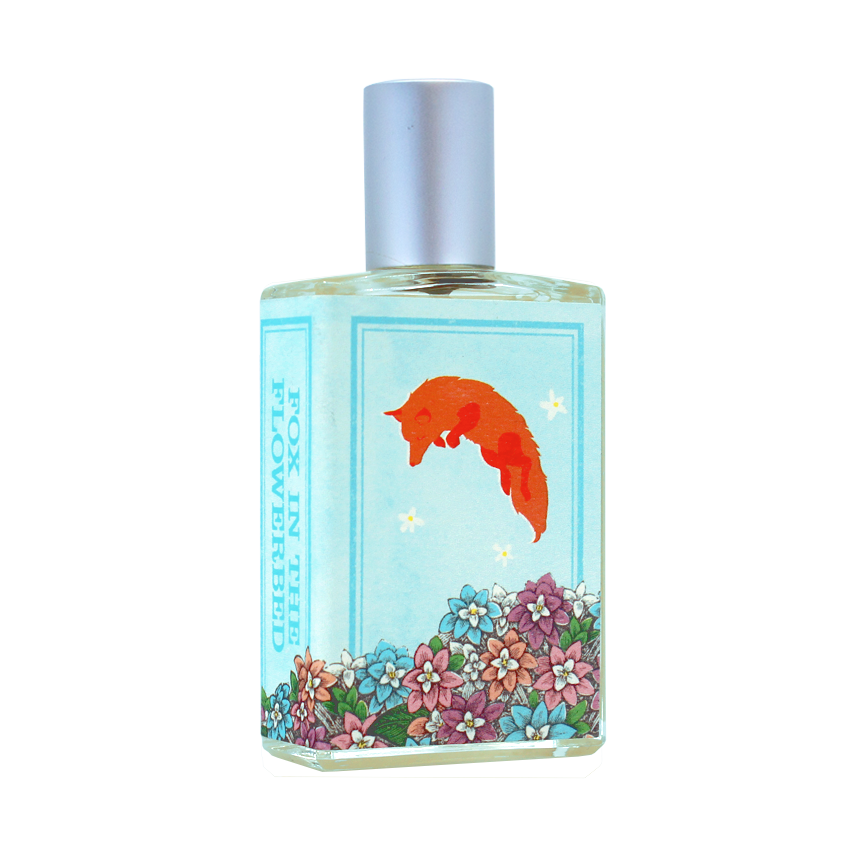 A perfume bottle with a blue label showcasing an illustration of a fox above a flower bed, titled "Fox in the Flowerbed." Evoking Alpine fairy tales, the floral fragrance of the pale yellow liquid inside is reminiscent of Chunhua Luli. This enchanting scent is brought to you by Imaginary Authors.