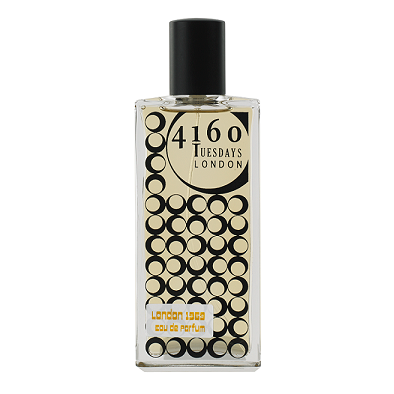 Glass perfume bottle with black cap, clear liquid, gold and black circular label