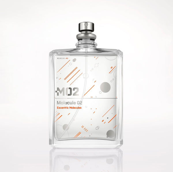 A clear glass bottle of Molecule 02 fragrance by Escentric Molecules with a modern design, featuring orange lines and circles on the front, and "M02" text. Infused with Ambroxan, the bottle is set against a plain white background.