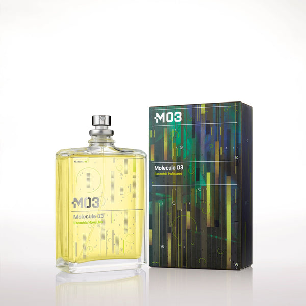 Eau de parfum bottle with silver cap and pale yellow liquid, beside M03 graphic box