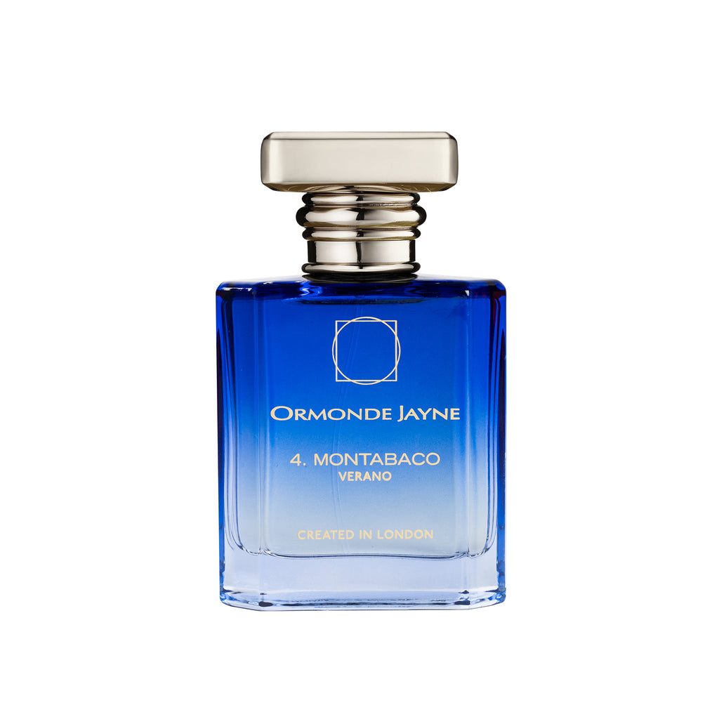 A blue-gradient glass bottle of Ormonde Jayne's limited edition fragrance labeled "Montabaco Verano," with "Created in London" printed at the bottom. The bottle features a unique square stopper with a rounded design.