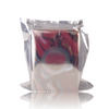 A silver foil packet containing Bloodflower by Parfums Quartana, with a transparent front revealing a portion of a dark rose-colored object inside.
