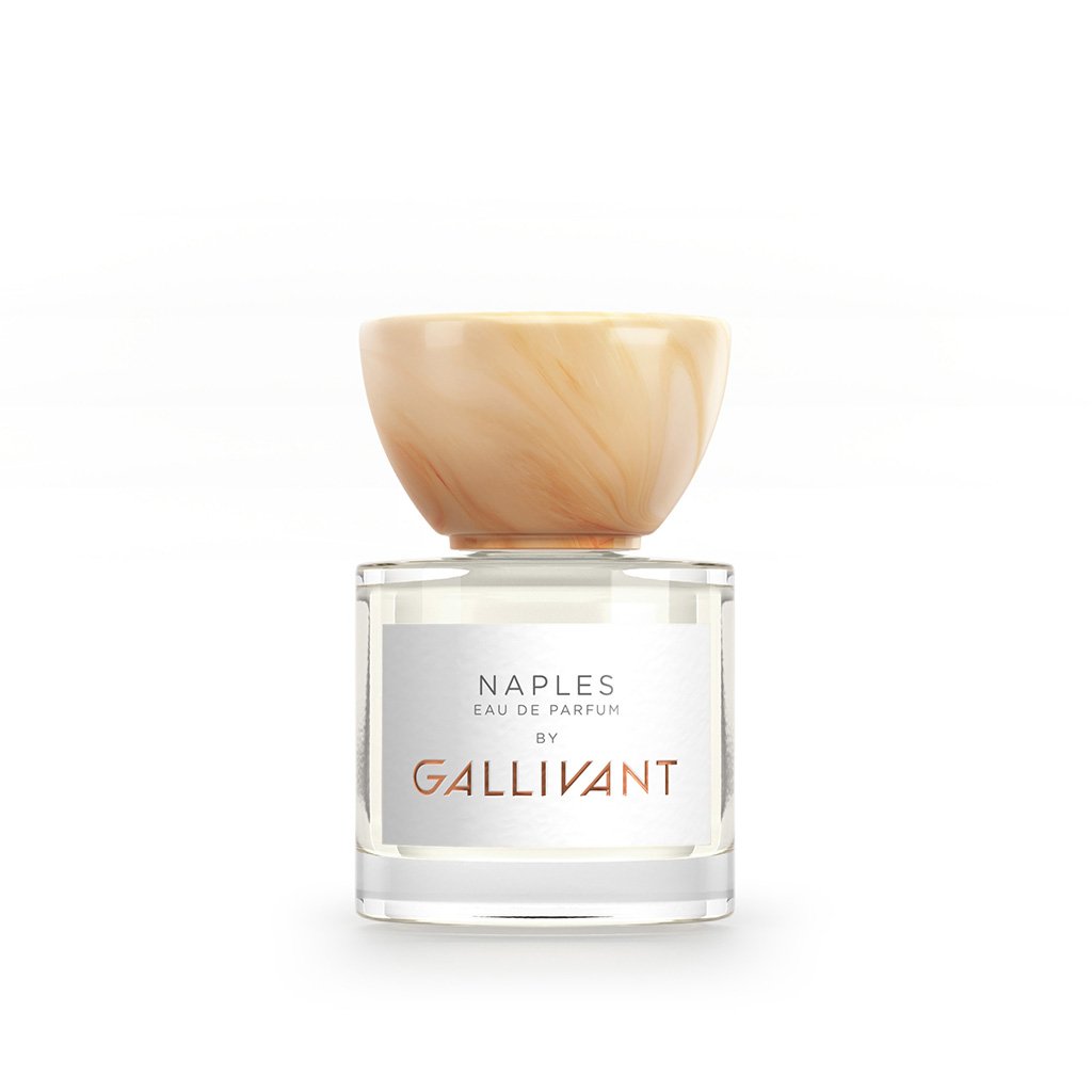 A bottle of Gallivant Perfumes' Naples Eau de Parfum, a citrus fragrance with a white label and beige cap.