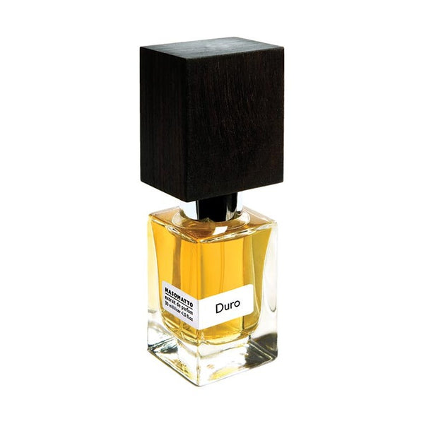 A bottle of Nasomatto's Duro perfume, featuring a black square cap and containing light amber liquid, exudes a sense of male strength.