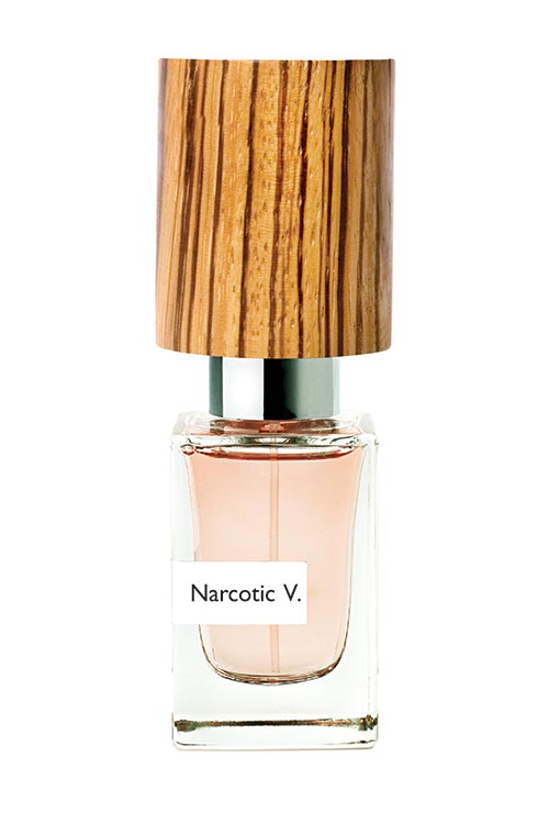 A clear glass bottle labeled "Narcotic Venus" from Nasomatto, with a wooden cap, containing a peach-colored liquid exuding an irresistible fragrance.
