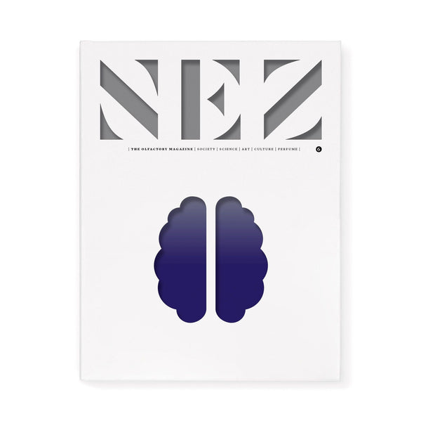 Magazine cover with large lettering at top and navy violet brain-like logo at center