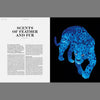 Blue watercolor-style feline illustration on book page with article text