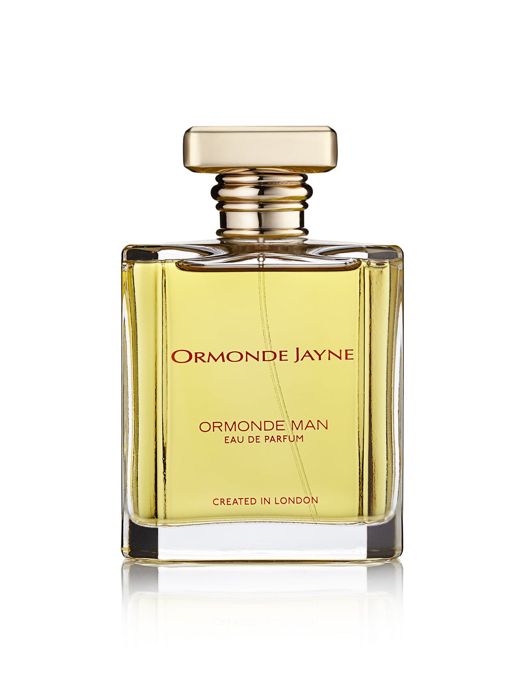 A bottle of Ormonde Jayne Ormonde Man Eau de Parfum, featuring a gold cap and yellow liquid, labeled "Created in London," emanates a sophisticated fragrance enriched by the luxurious essence of oudh oil.