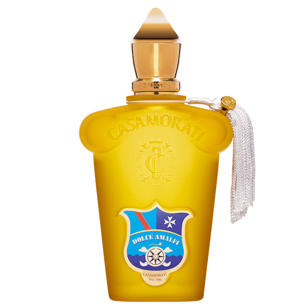 A romantic bottle of Dolce Amalfi perfume by Casamorati, adorned in yellow and embellished with a blue and red crest and a white tassel, capturing the enchanting essence of the Amalfi Coast.