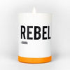 REBEL Bahia candle in white glass with orange base and black logo text