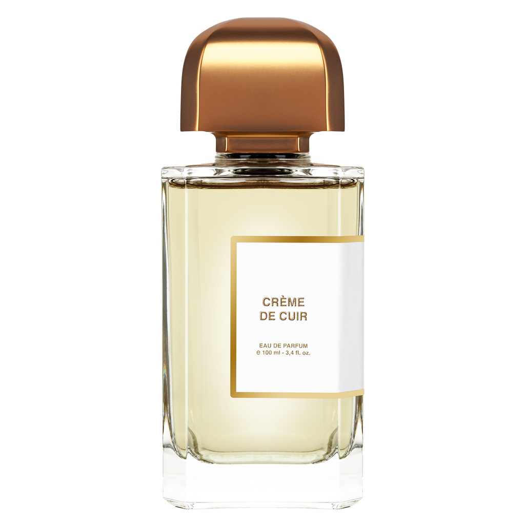 A 100 ml (3.4 fl. oz.) bottle of Crème de Cuir by BDK Parfums captures contemporary sensuality with its exquisite fragrance. The bottle's transparent body, adorned with a white suede label and topped with a shiny, gold-colored cap, epitomizes elegance and sophistication.